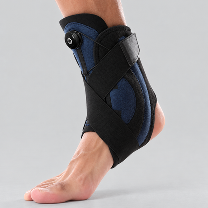 Ankletica adjustable dial ankle brace in navy, side view worn on foot